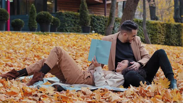 Happy Guy and Girl Date in Autumn Park Beautiful Woman Brunette Handsome Bearded Man Resting on