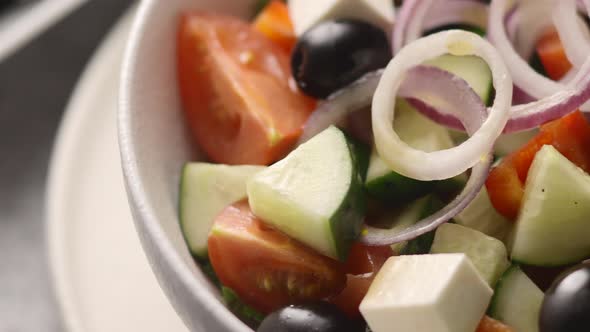 Greek salad sprinkled with dried basil	