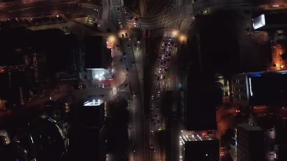 Aerial Birds Eye Overhead Top Down Panning View of Traffic Around Intersection