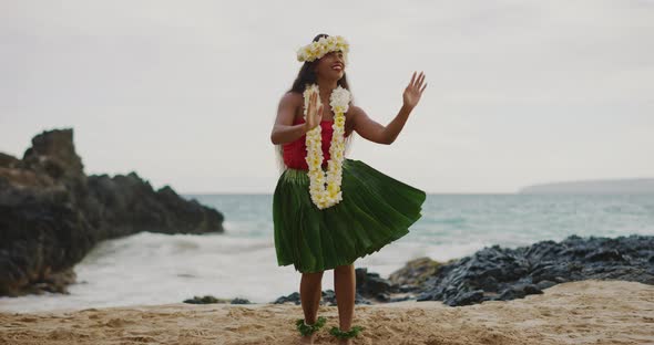 Woman performing Hawaiian hula on the beach