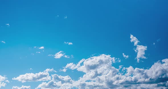 Blue Sky with White Clouds Floating on Windy Day