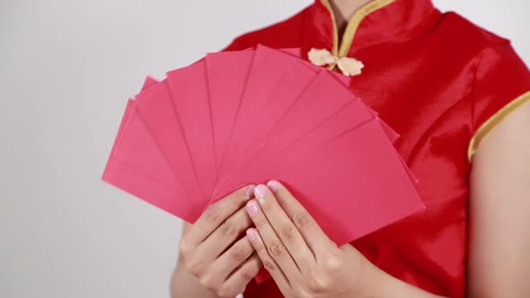 hand holding red envelope in concept of happy chinese new year