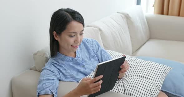 Woman watch on tablet computer