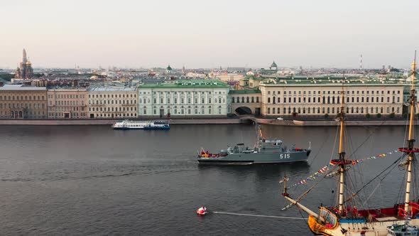 Aerial Landscape of a Modern Military Boat Goes Along the Palace Embankment at Early Morning a