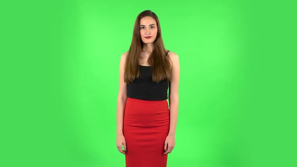 Girl Threatens with a Fist. Green Screen