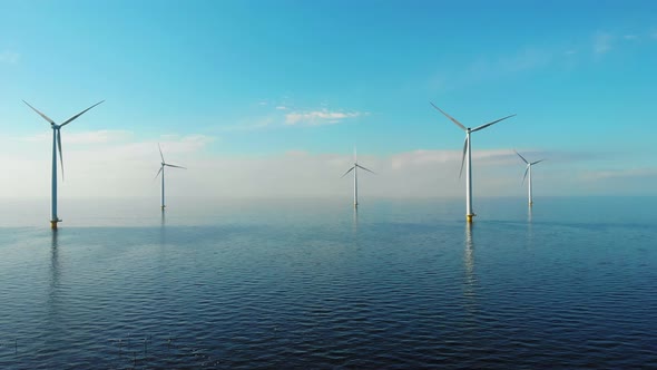 Windmill Park in the Ocean Drone Aerial View of Windmill Turbines Generating Green Energy Electric