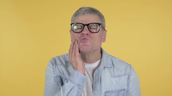 Toothache, Casual Senior Man with Tooth Pain on Yellow Background