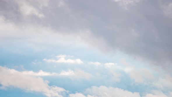 Puffy fluffy white clouds timelapse. Blue sky white clouds. Cumulus cloud cloudscape at Summer blue