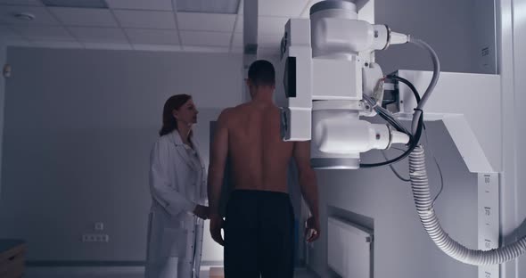 Mature Doctor Starting X Ray Scanning for Male Patient