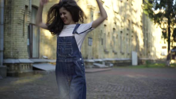 Excited Young Woman Rejoicing Jumping Walking at University Campus Leaving