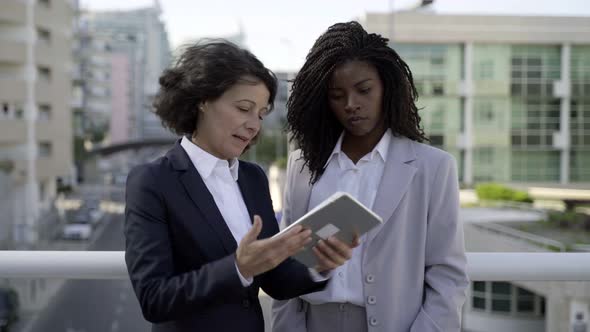 Businesswomen Using Digital Tablet Outdoor