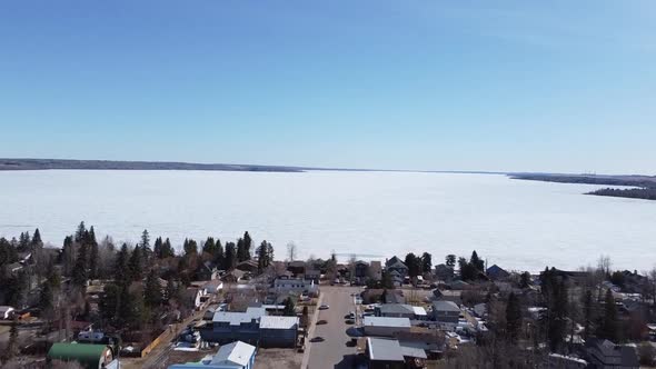 Aerial over Main Street Towards Frozen Lake