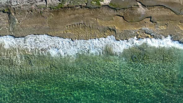 Texture of the rocky beach aerial view 4 K Turkey Alanya