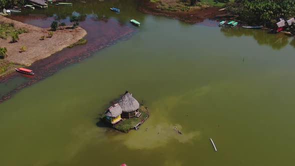 4K daytime aerial drone view - a beautiful house over the water at Laguna de los Milagros (Miracles