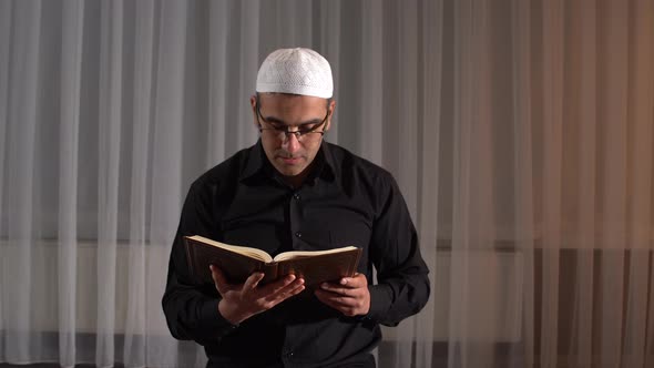 Muslim man reading quran.