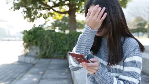 Woman using mobile phone at outdoor