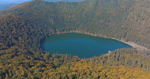 St. Ana's Lake, Transylvania, Romania - Stunning autumn scenery with colorful forest and idyllic vol