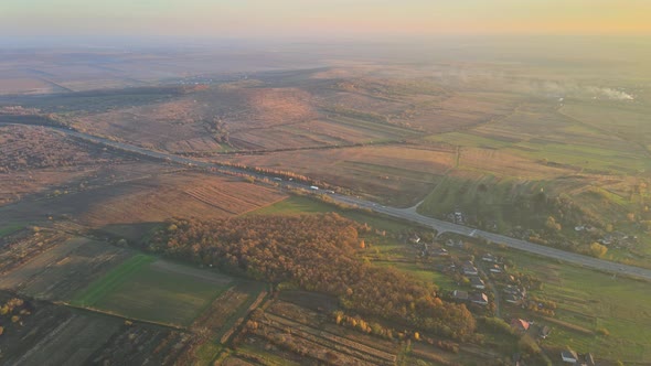 Aerial Panorama View Awesome Evening Sunset in Below Valley with Mountain Road