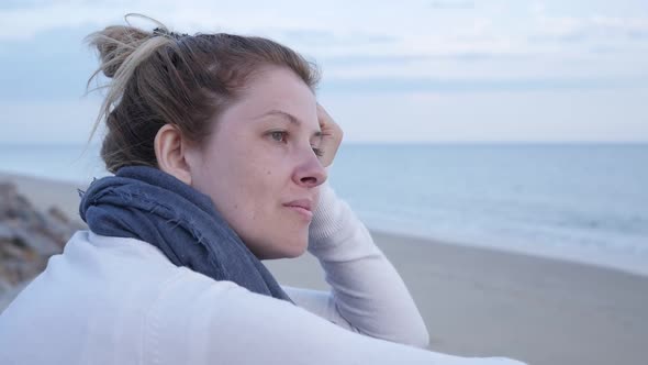 Lonely Caucasian blond female  near ocean evening scene slow-mo 1920X1080 HD footage - Slow motion o