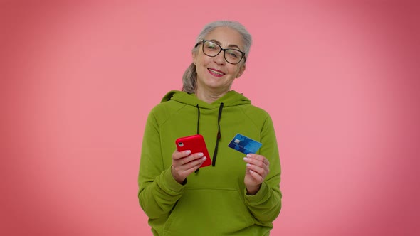 Senior Old Stylish Granny Woman Using Credit Bank Card and Smartphone Purchases Online Shopping