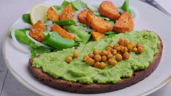 Cooking Guacamole Toast with Crispy Chickpeas and Fresh Green Salad with Baked Sweet Potatoes