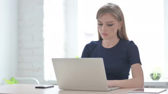 Woman Having Back Pain While Using Laptop