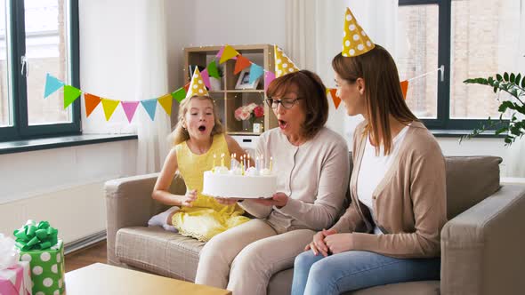 Mother, Daughter, Grandmother with Birthday Cake