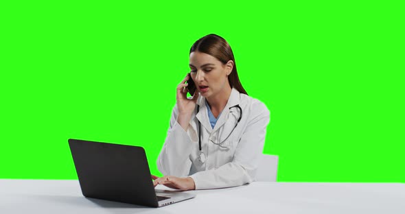 Caucasian female doctor on green screen background