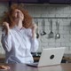 Excited Redhead Young Business Woman Sits at Table with Laptop Computer Working in Home Office - VideoHive Item for Sale