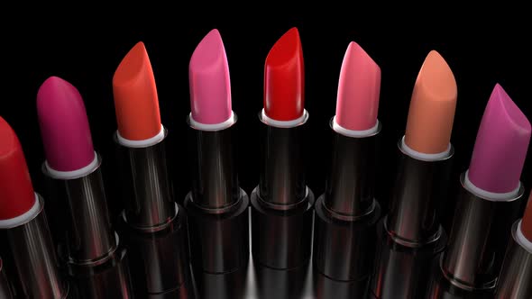 Lipsticks with the Red Palette Rotates on the Showcase in the Perfume Store alt