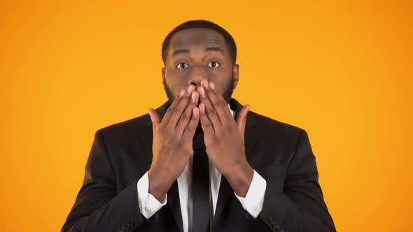 Surprised African-American Male in Businesswear, Overwhelming Proposition