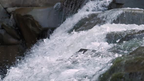 Raging Mountain River. Wildness of Clean, Clear Water in the Mountain River. Slow Motion