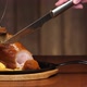 A Man's Hand Cuts an Appetizing Meat Dish Into the Bone with a Knife. Ready Meat Dish with Garnish - VideoHive Item for Sale