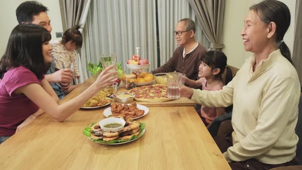 Happy family time and relationship, Asian big family having small party eating food together at home