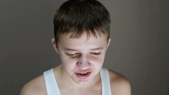 Portrait of a Face of a Talking Teenager Looking Down