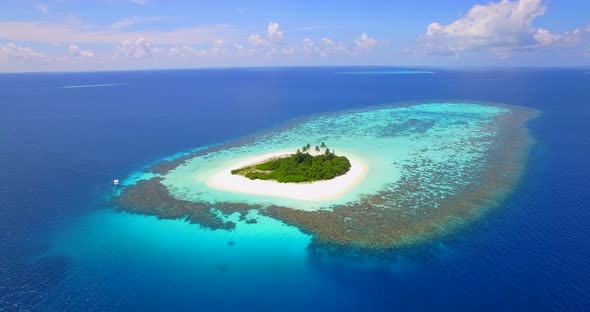 Aerial drone view of a scenic tropical island in the Maldives.