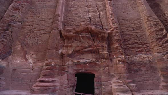 A Reveal Shot of Ancient Temple Facade Carved Out of the Sandrock in Ancient City of Petra