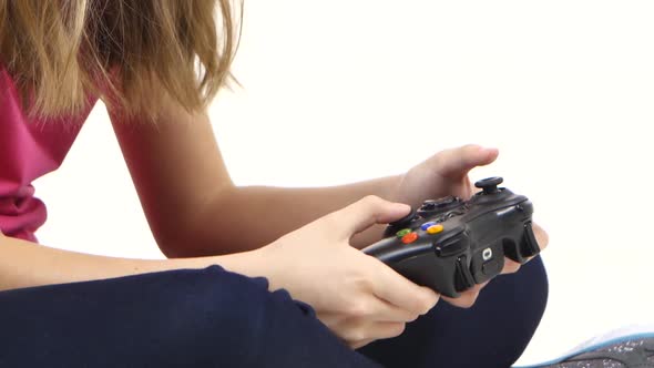 Hands of Kid Play on Console, Presses Buttons. Close Up