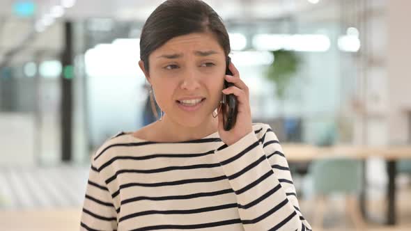 Portrait of Aggressive Indian Woman Angry on Smartphone