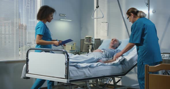 Doctor Visiting Patient in Hospital