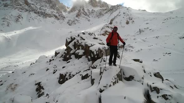 Trekking Of Climber On Snowy Hill