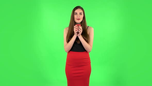 Cheerful Young Woman Enjoying Coffee on Green Screen