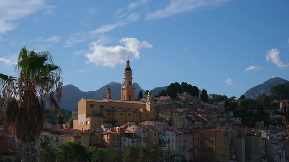 Menton during day and Saint Michel Archange Basilica in Cote d'Azur, (France). Cathedral, Catholic c