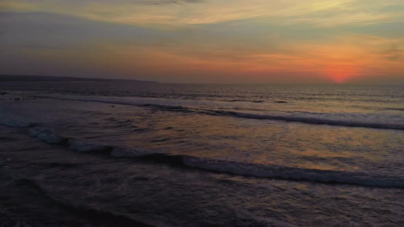 Flight at Sunset Overlooking the Indian Ocean in Bali Indonesia