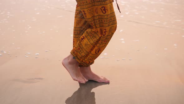 Woman Tourist Walking on the Beach Near the Ocean at the Sunset, India Ocean