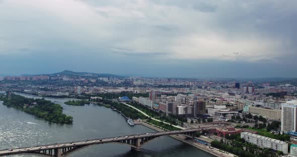 The City is on a Wide River View From a Drone