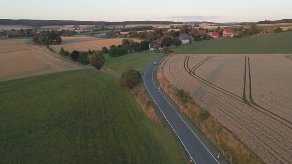 Drone shot following a car in Germany town