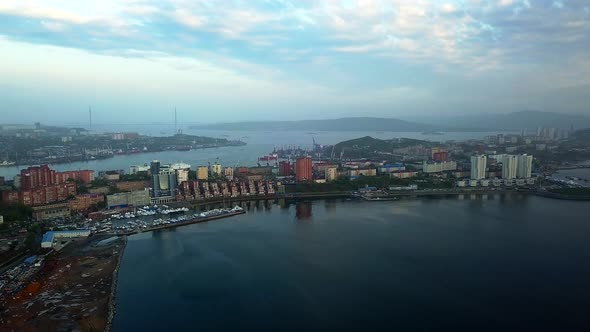 Drone View of the City and Marina Located on the Peninsula at Sunset