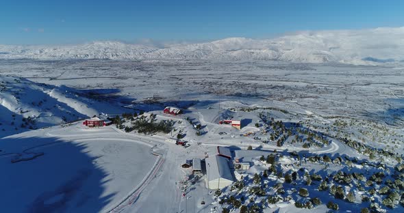 Ski Center Snowy Mountains And Skiers Aerial View