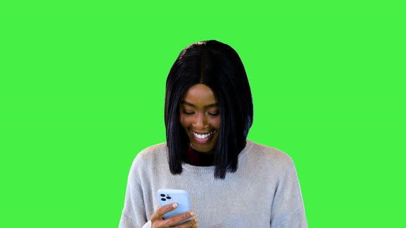 Happy Smiling Black Girl Read Text Message in Smartphone Chatting in Social Media Application Online